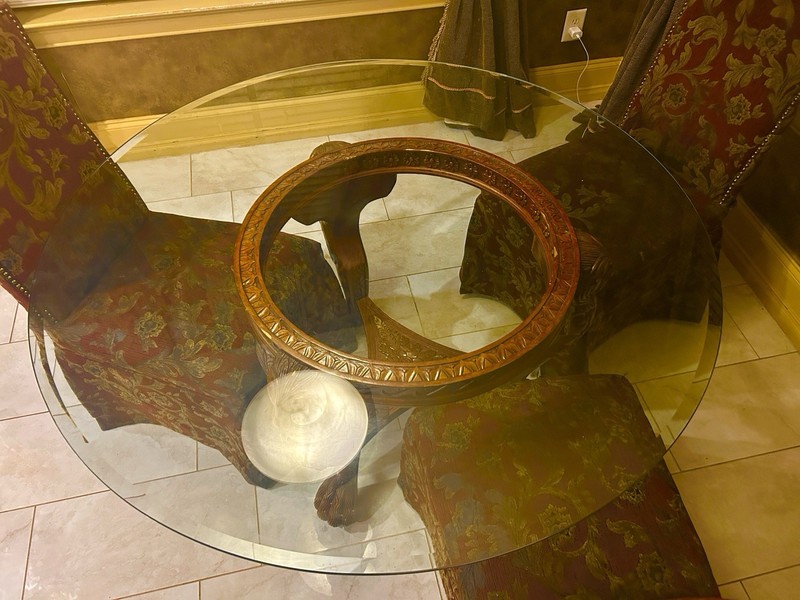 Beautifully carved round mahogany table with 52” glass top gallery