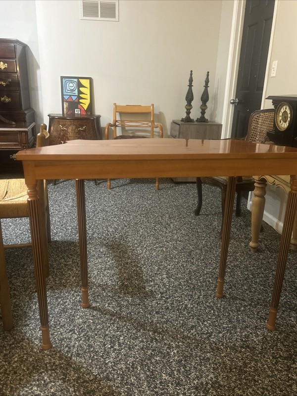This is a Federal style mahogany and satinwood inlaid serpentine console.