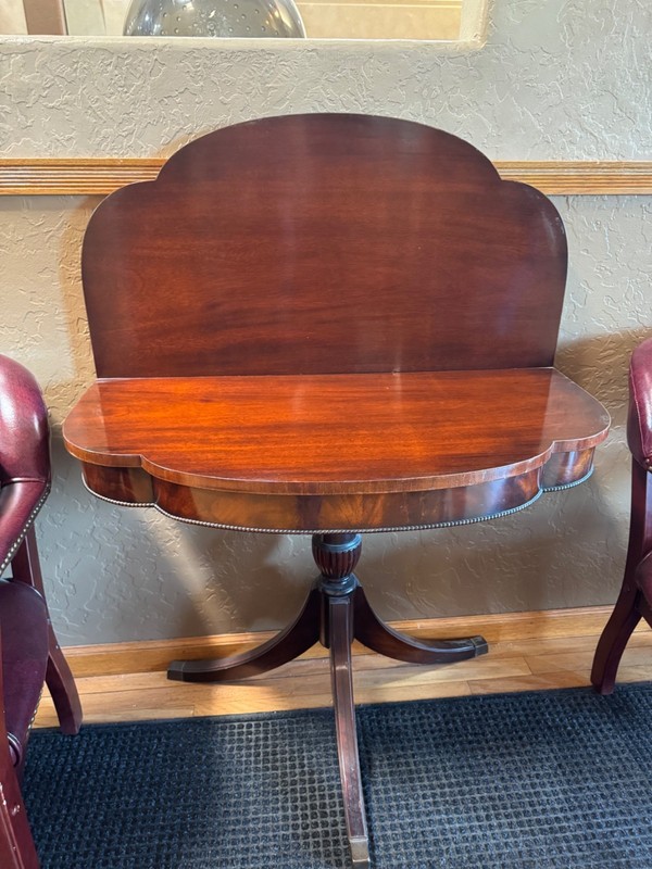 Victorian- or Regency‑style mahogany pedestal/fold-over card (or tilt‑top) table