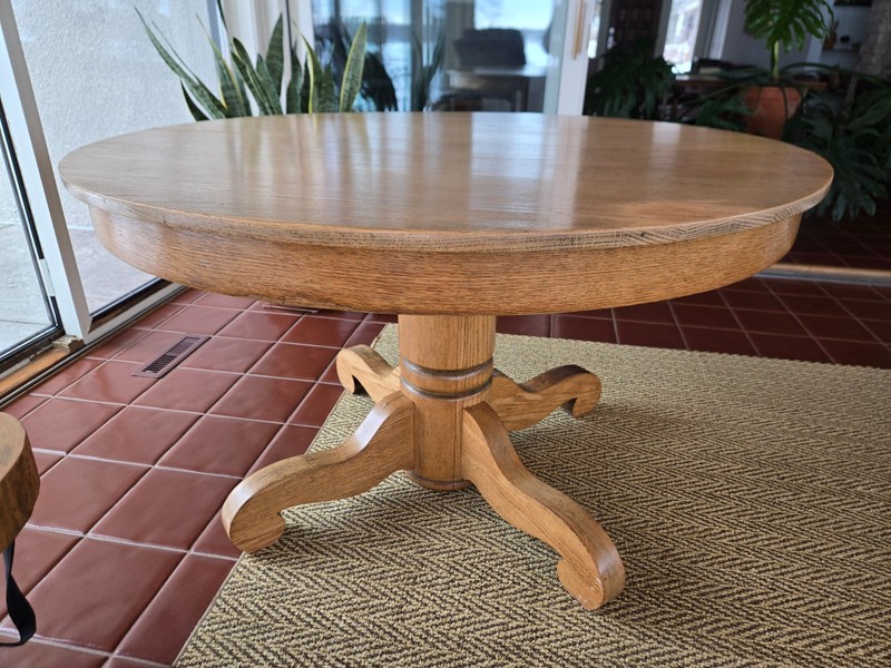 Antique Round Oak Dining Table with Pedestal Base and three 9″-wide Leaves