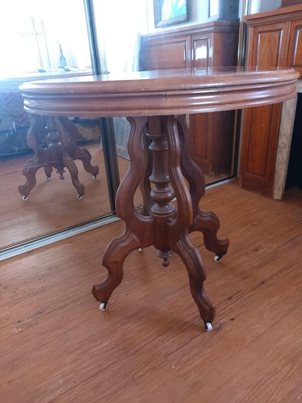 Antique Victorian Walnut Wood Oval Carved Parlor Table Finial Porcelain Casters gallery