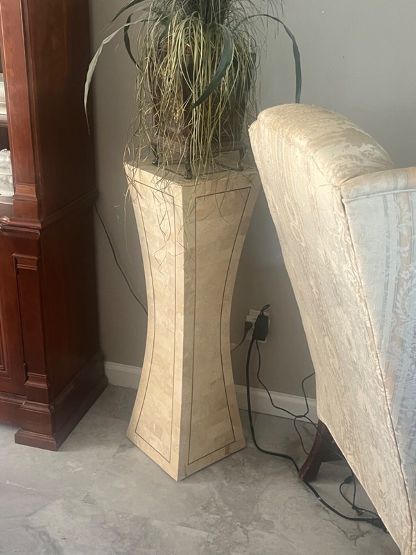 large tessellated stone and brass pedestal