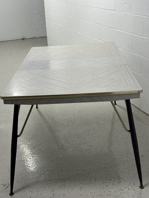 Vintage formica top rectangular kitchen table with a white and gray lined design
