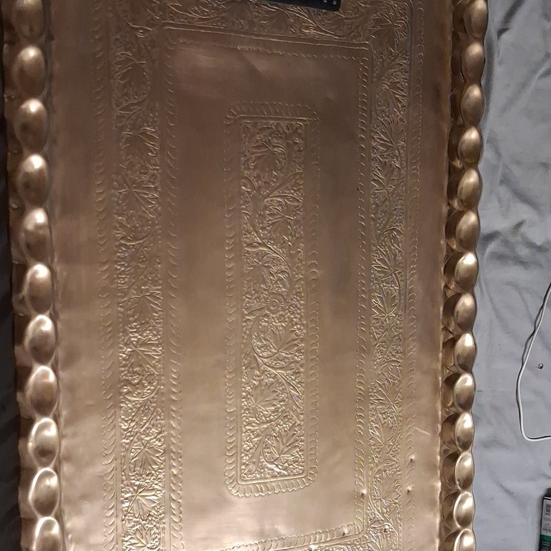 brass Tray coffee table handmade it is about 48 inches long 30 inches wide.