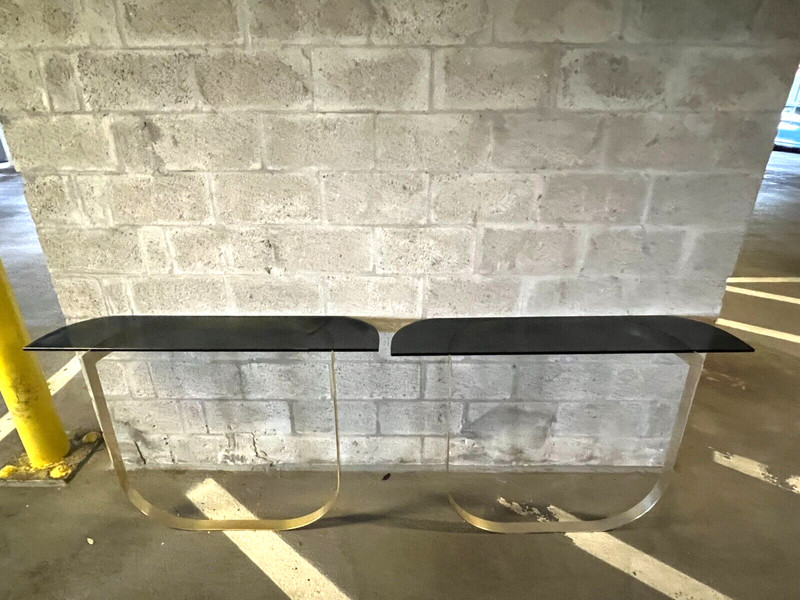 Fabulous 1970’s Modernistic Curved Brass and Black Glass Console Tables – A Pair