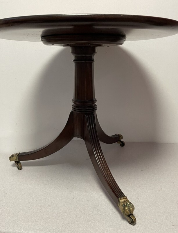 Antique mahogany Regency style coffee table on pedestal base ending fluted legs gallery