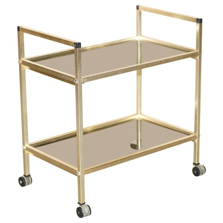 MID CENTURY MODERN GLASS AND POLISHED BRASS CIRCA 1950’S DRINKS TROLLEY