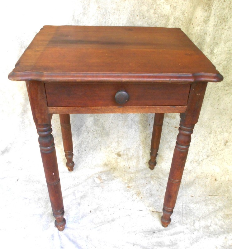 ANTIQUE SHERATON SHAPED TOP WALNUT ONE DRAWER STAND WITH COOKIE CORNERS