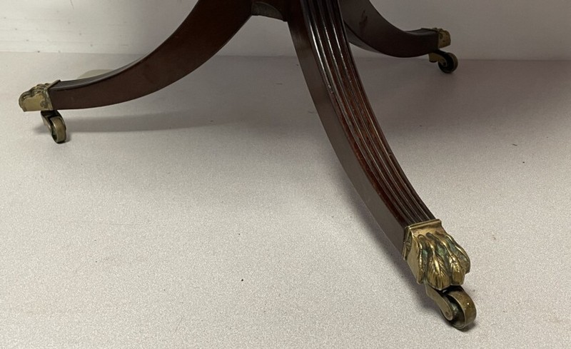 Antique mahogany Regency style coffee table on pedestal base ending fluted legs gallery