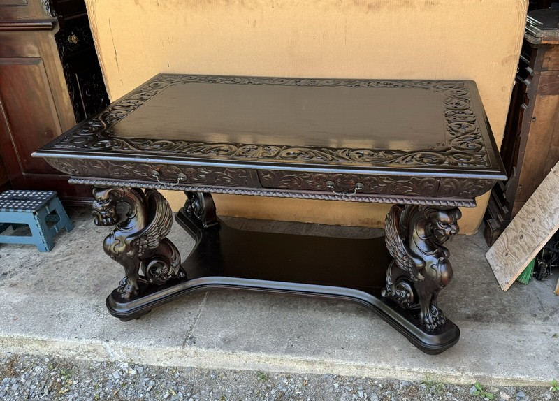 R. J. HORNER CARVED WINGED GRIFFIN LIBRARY TABLE