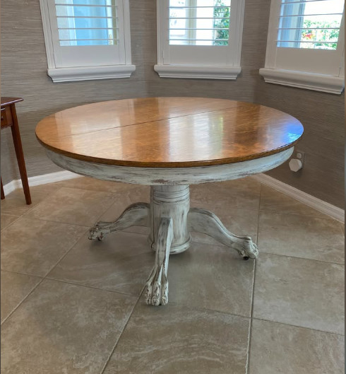 Dining table in Vintage Tiger Oak. 48″ wide with three 12″ leaves. Veneer top.