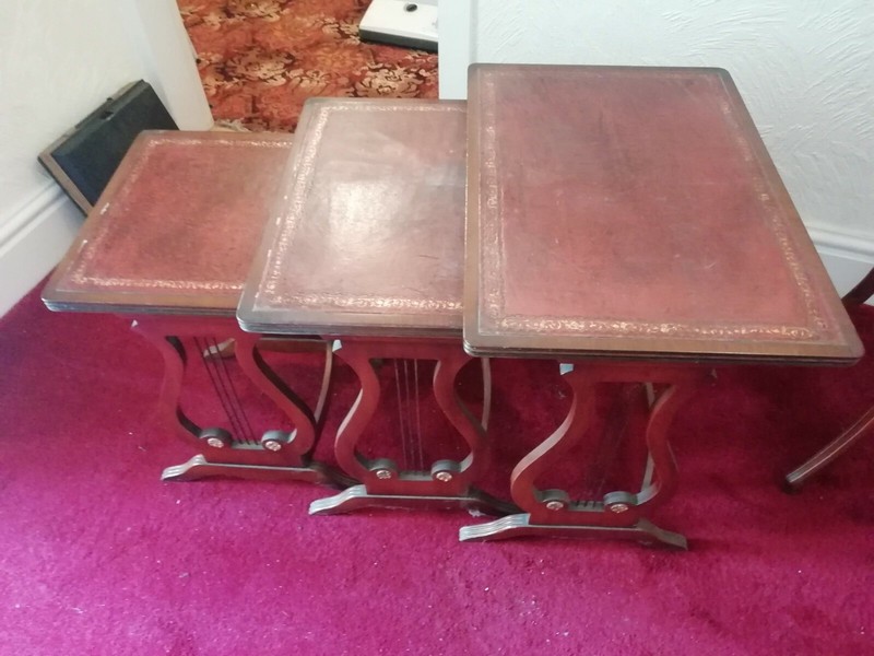nest of three tables – Leather topped, age unknown