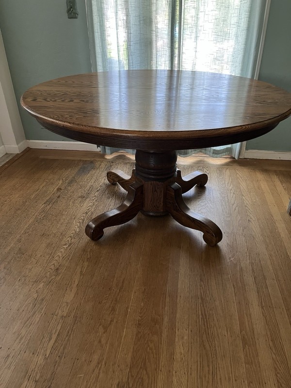 Solid Oak Table. 54” Round. Great Condition. 3 Leaves. From The 70’s. gallery