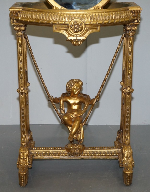CIRCA 1920 GOLD GILTWOOD OCCASIONAL TABLE WITH MIRROR TOP & CHERUB PUTTI SWING gallery