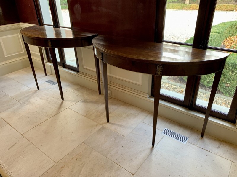 Antique Demilune Console Tables With Brass Ormolu Mounts—A Pair