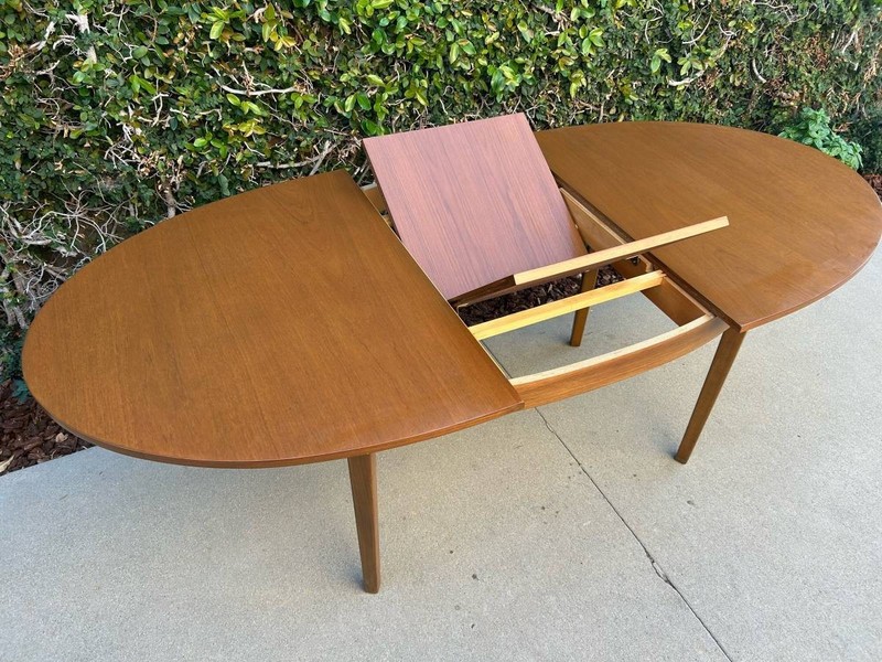 Mid Century Modern Teak Oval Butterfly Leaf Dining Table.