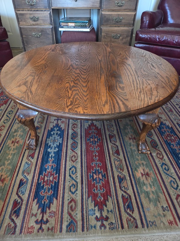 42″ round solid Tiger Oak Coffee table with carved legs.