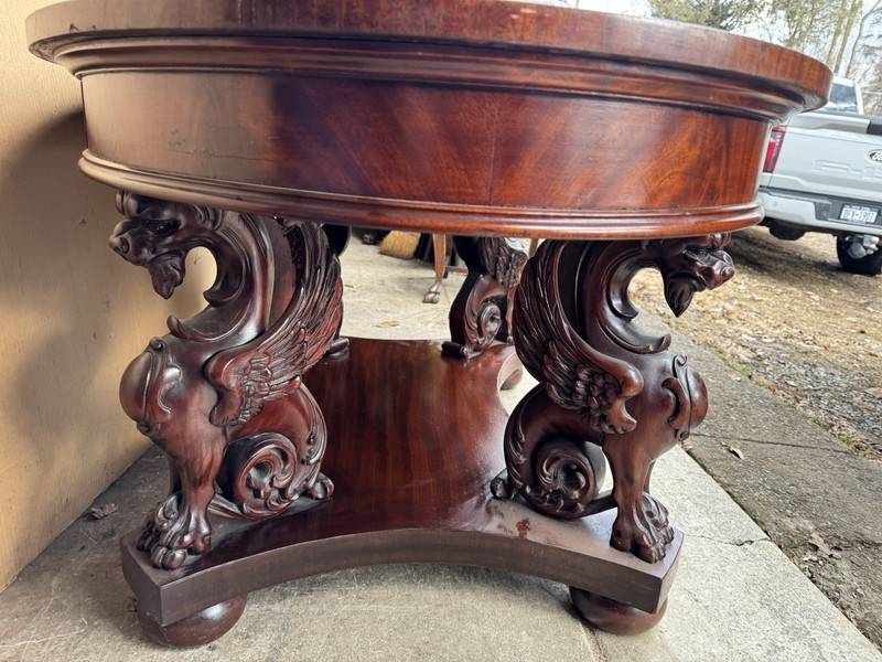 R. J. HORNER CARVED MAHOGANY WING GRIFFIN OVAL LIBRARY TABLE gallery