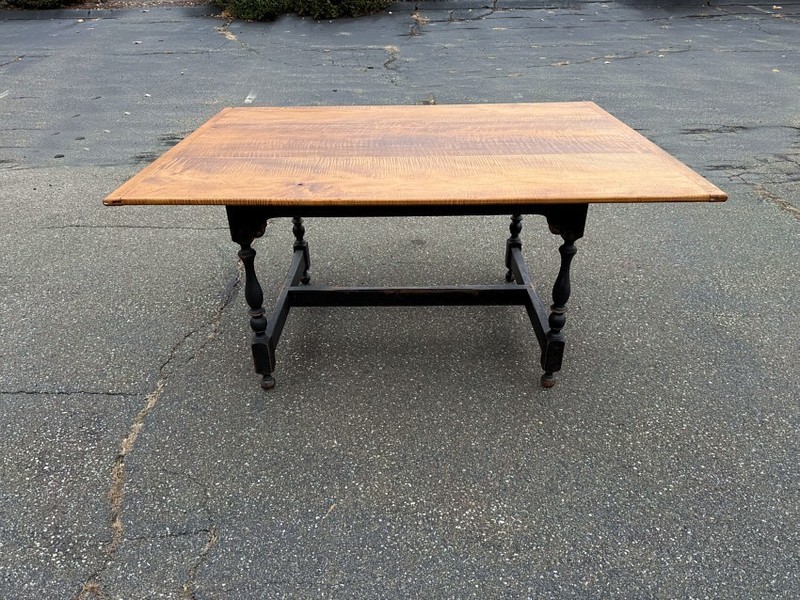 Strong Tiger maple harvest table on crackle black stretcher base Three board top