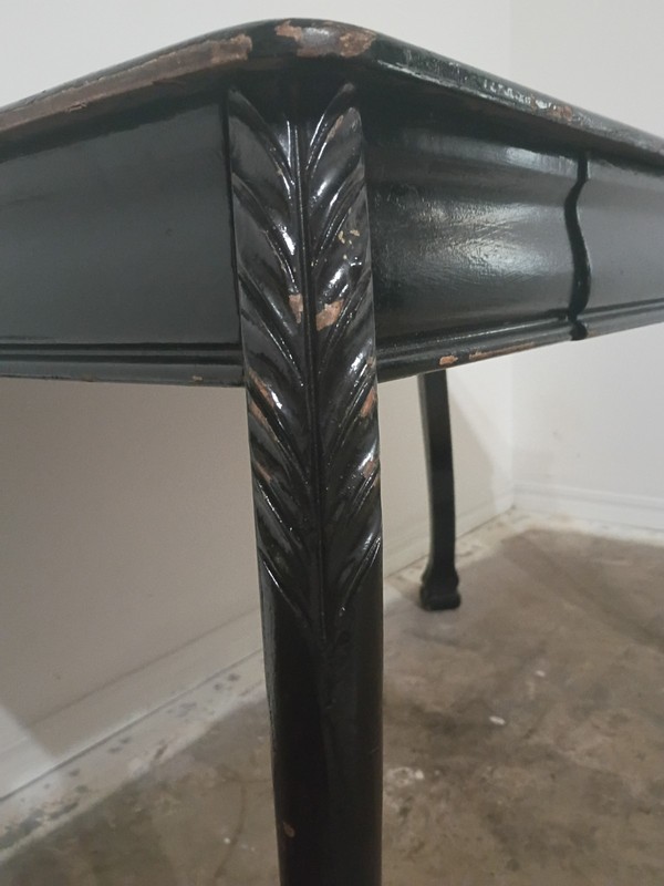 Antique table 1899-1925,Black in color, 30 inches tall by 46 inches wide. gallery