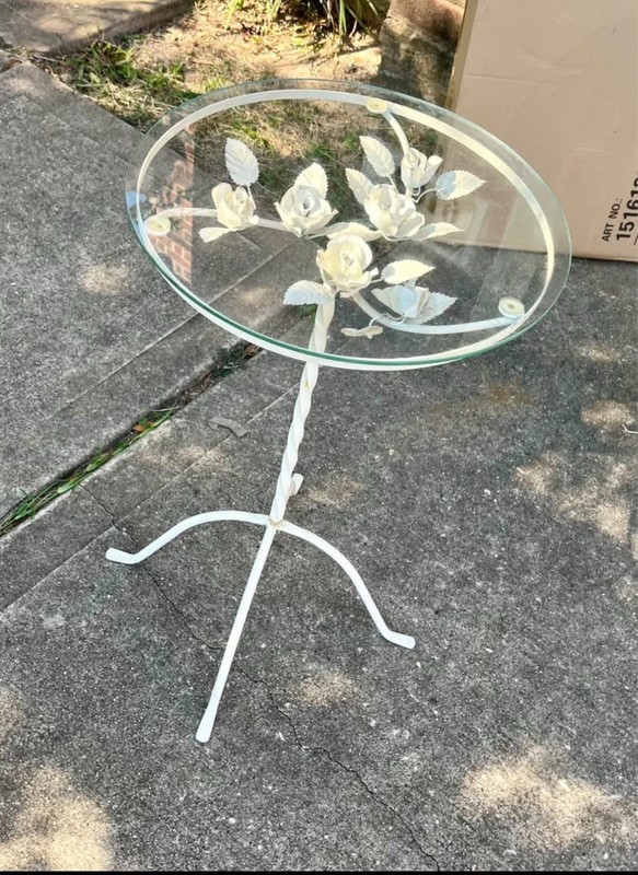 Vintage wrought iron side / end table with a glass top and a rose design