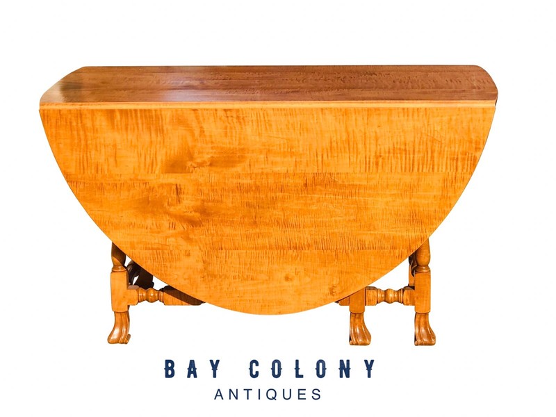 QUEEN ANNE STYLE TIGER MAPLE DROP LEAF DINING TABLE WITH CARVED TRIFID FEET