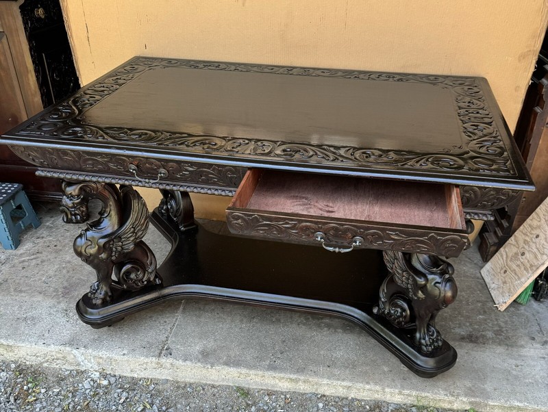 R. J. HORNER CARVED WINGED GRIFFIN LIBRARY TABLE gallery
