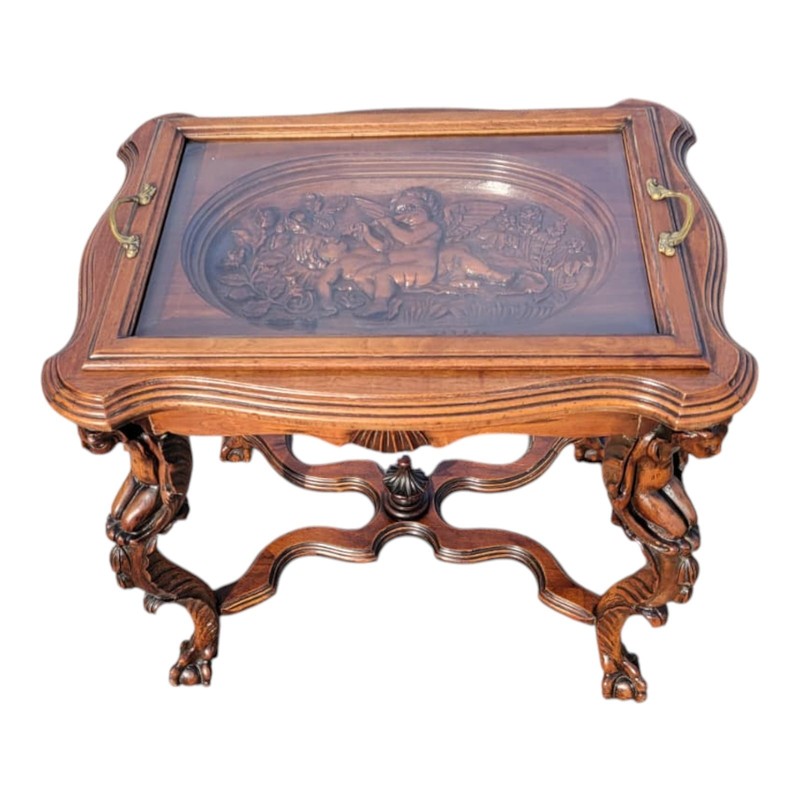 1920 Ornate Carved Angel coffee Table with Glass Top and Sculptural Legs