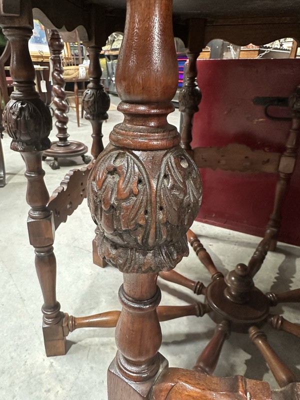 Vintage Barnard & Simonds Round Table With Carved Legs And Spindle Wheel Base gallery