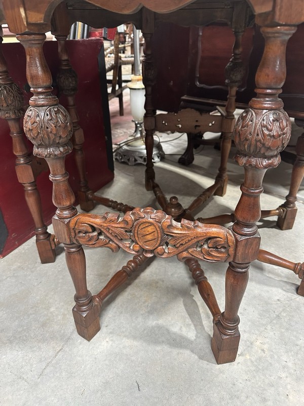 Vintage Barnard & Simonds Round Table With Carved Legs And Spindle Wheel Base gallery