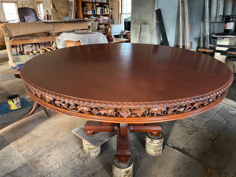 Antique 60" Round Table with hand carved apron gallery