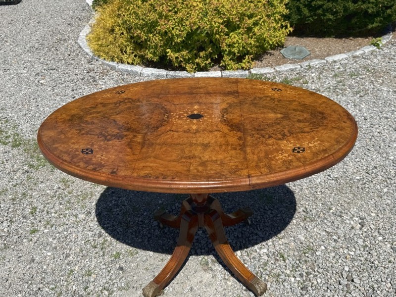 English Regency tilt top oval breakfast dining table Book matched burl walnut gallery